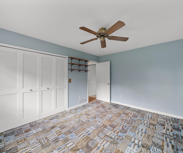 4641 Wylie Rd, Dexter, MI 48130 - unfurnished bedroom with a closet, ceiling fan, and carpet floors