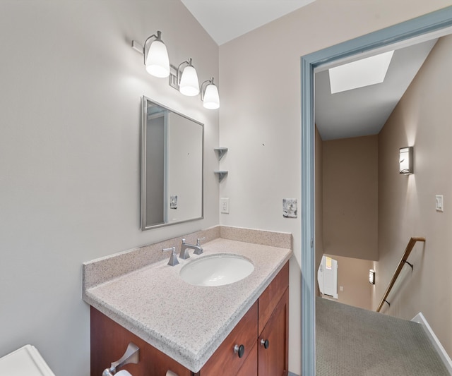 4641 Wylie Rd, Dexter, MI 48130 - bathroom with vanity and a skylight