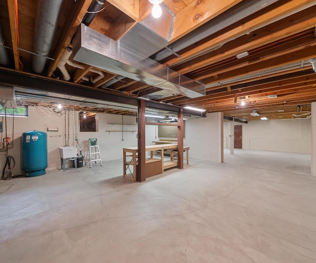 4641 Wylie Rd, Dexter, MI 48130 - below grade area with a water pressure tank and a sink