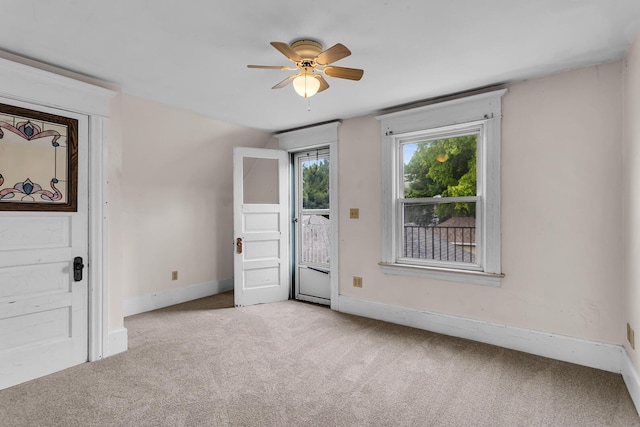 1218 Forest Ave, Jackson, MI 49201 - carpeted entrance foyer with a ceiling fan and baseboards