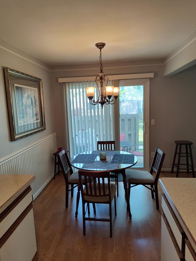 24654 Spring Ln, Harrison Township, MI 48045 - dining area featuring a chandelier and dark wood-style floors