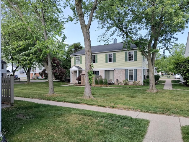 24654 Spring Ln, Harrison Township, MI 48045 - view of front of house featuring brick siding and a front yard