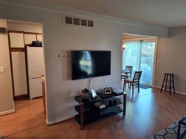 24654 Spring Ln, Harrison Township, MI 48045 - living area with light wood-style flooring and baseboards