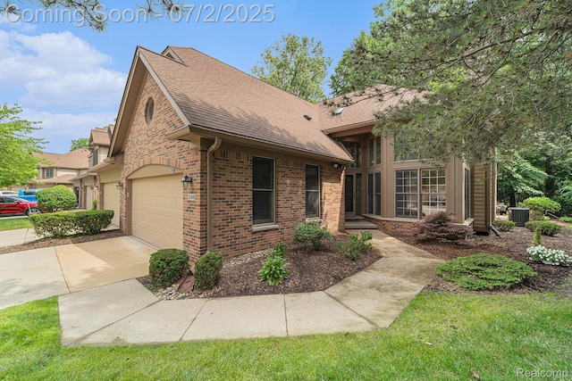 5200 Royal Vale Ln, Dearborn, MI 48126 - view of front of house with brick siding, a shingled roof, and driveway