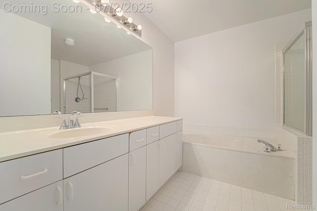 5200 Royal Vale Ln, Dearborn, MI 48126 - bathroom featuring vanity, a garden tub, an enclosed shower, and tile patterned floors