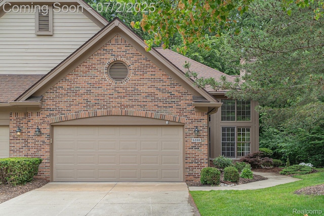 5200 Royal Vale Ln, Dearborn, MI 48126 - view of front of home featuring brick siding, concrete driveway, and a shingled roof