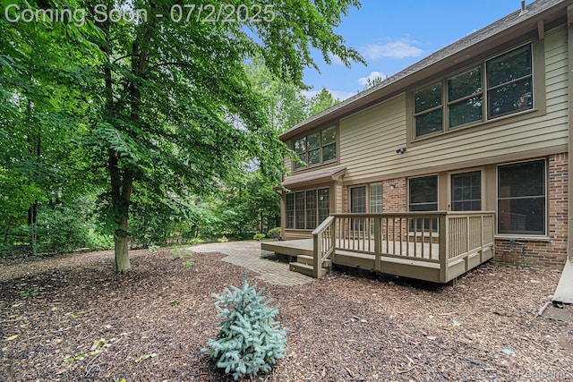 5200 Royal Vale Ln, Dearborn, MI 48126 - rear view of house featuring brick siding and a deck