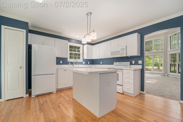 5200 Royal Vale Ln, Dearborn, MI 48126 - kitchen with white appliances, ornamental molding, white cabinetry, light countertops, and a center island