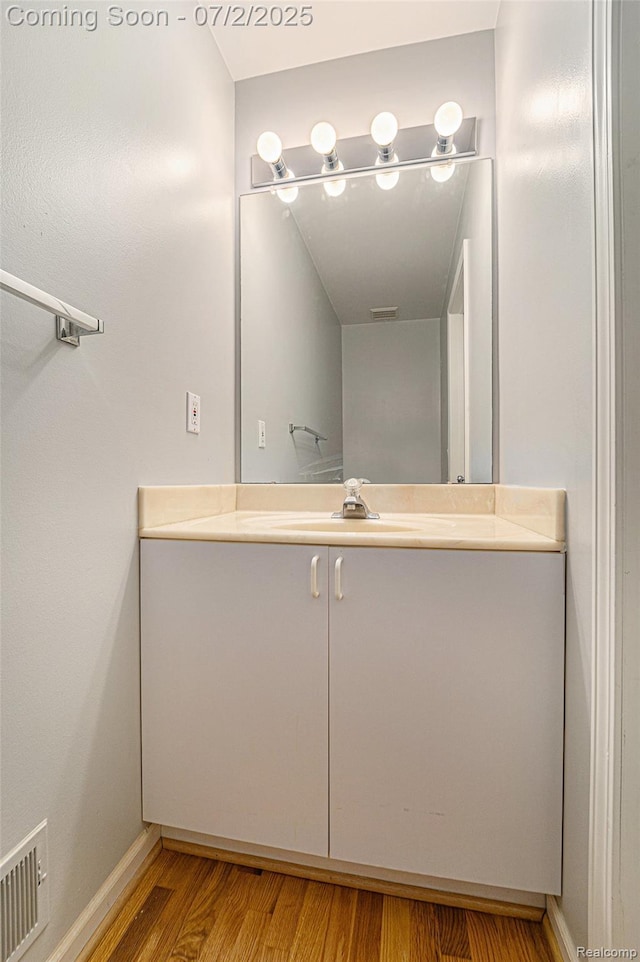 5200 Royal Vale Ln, Dearborn, MI 48126 - bathroom featuring vanity and wood finished floors