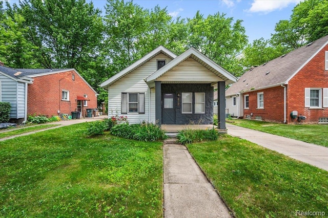 2124 Catalpa Dr, Berkley, MI 48072 - view of front of house with covered porch and a front yard
