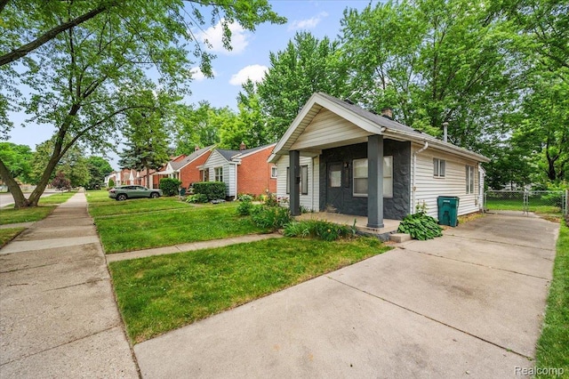 2124 Catalpa Dr, Berkley, MI 48072 - view of front of property with stone siding, driveway, and a chimney