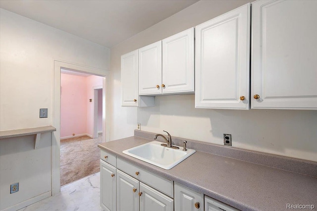 2124 Catalpa Dr, Berkley, MI 48072 - kitchen featuring white cabinetry and light marble finish floors