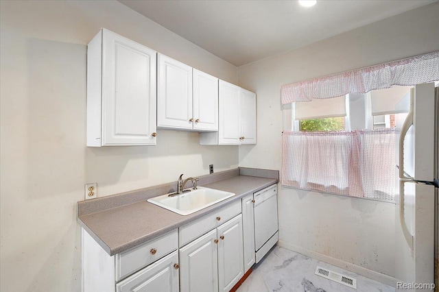 2124 Catalpa Dr, Berkley, MI 48072 - kitchen featuring white appliances, light marble finish floors, white cabinetry, and light countertops
