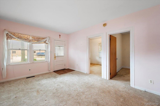 2124 Catalpa Dr, Berkley, MI 48072 - entrance foyer with carpet floors and baseboards