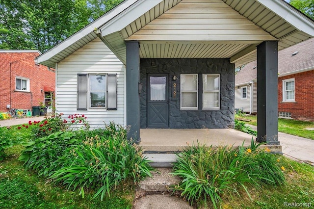 2124 Catalpa Dr, Berkley, MI 48072 - bungalow featuring stone siding and a porch