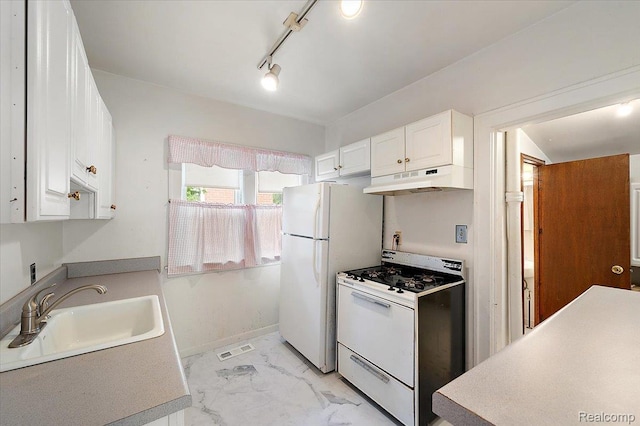 2124 Catalpa Dr, Berkley, MI 48072 - kitchen with white appliances, under cabinet range hood, white cabinetry, and light marble finish flooring