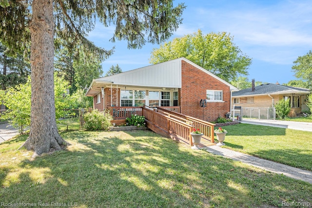 35221 Weideman St, Clinton Township, MI 48035 - bungalow with brick siding, a wooden deck, and a gate