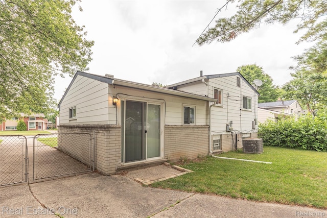 31121 Avondale St, Westland, MI 48186 - rear view of property featuring brick siding and a gate