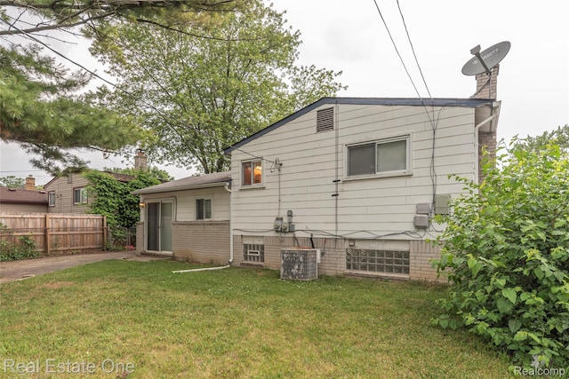 31121 Avondale St, Westland, MI 48186 - back of property featuring a chimney and brick siding