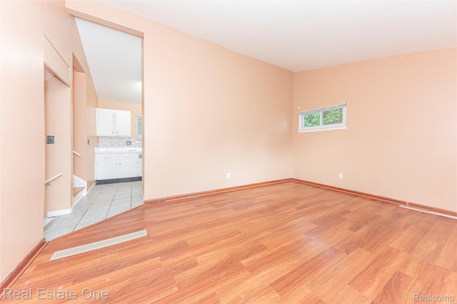 31121 Avondale St, Westland, MI 48186 - spare room featuring light wood-style floors and baseboards