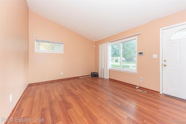 31121 Avondale St, Westland, MI 48186 - entryway with light wood-type flooring and vaulted ceiling