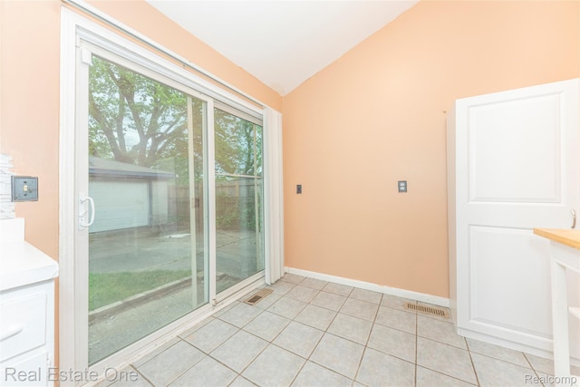 31121 Avondale St, Westland, MI 48186 - spare room featuring lofted ceiling and light tile patterned floors