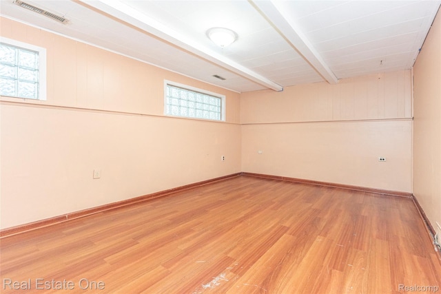 31121 Avondale St, Westland, MI 48186 - unfurnished room with light wood-style floors, healthy amount of natural light, and beam ceiling