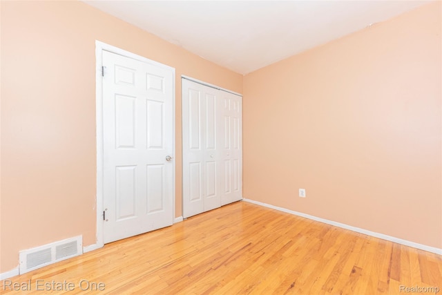 31121 Avondale St, Westland, MI 48186 - unfurnished bedroom featuring light wood-style floors and a closet
