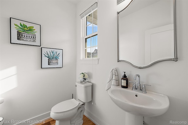 4260 Kent Rd, Royal Oak, MI 48073 - bathroom featuring toilet and wood finished floors