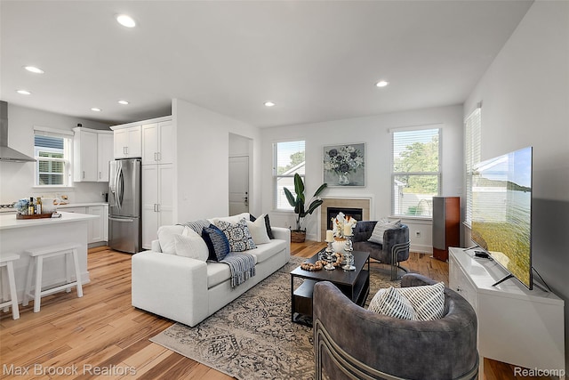 4260 Kent Rd, Royal Oak, MI 48073 - living area featuring light wood finished floors, recessed lighting, and a tiled fireplace