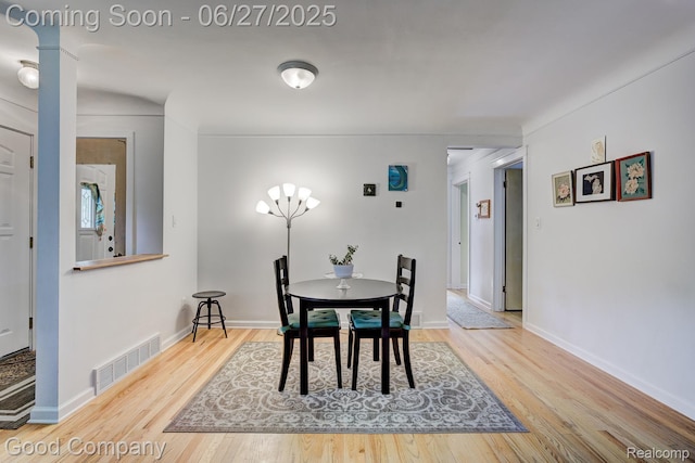 24745 Ross Dr, Redford, MI 48239 - dining area with wood finished floors and ornate columns