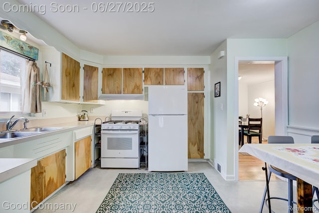 24745 Ross Dr, Redford, MI 48239 - kitchen featuring white appliances, light countertops, under cabinet range hood, concrete flooring, and brown cabinetry