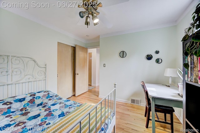24745 Ross Dr, Redford, MI 48239 - bedroom featuring light wood-style floors, crown molding, a closet, and ceiling fan