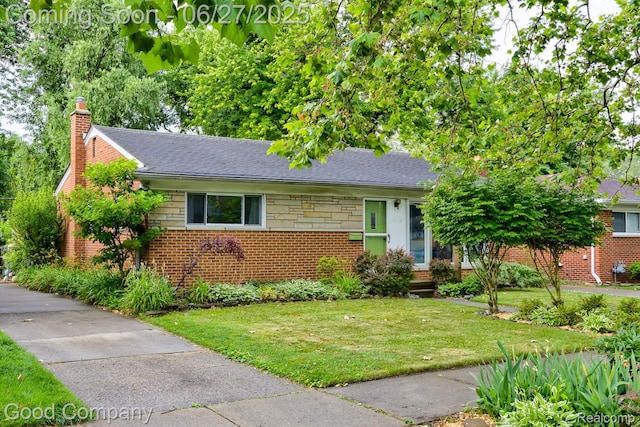 24745 Ross Dr, Redford, MI 48239 - view of front facade featuring a front lawn, a chimney, and brick siding