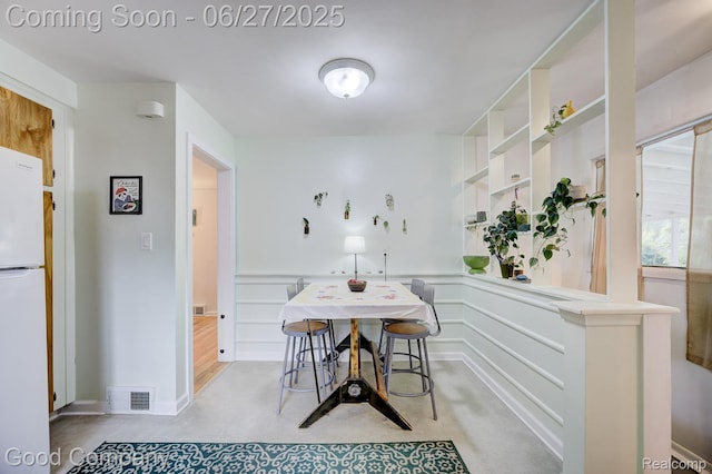24745 Ross Dr, Redford, MI 48239 - dining space with a wainscoted wall and a decorative wall