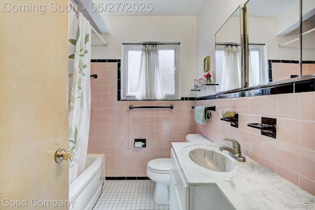 24745 Ross Dr, Redford, MI 48239 - bathroom featuring tile patterned flooring, tile walls, vanity, shower / tub combo, and wainscoting