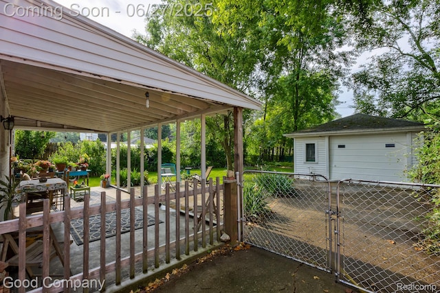 24745 Ross Dr, Redford, MI 48239 - view of patio with a gate, a grill, and a detached garage