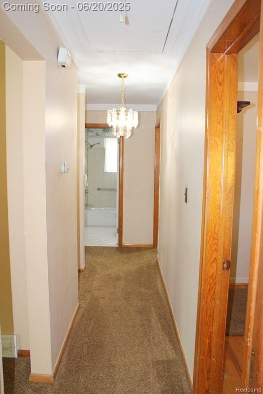 9396 Allen Rd, Allen Park, MI 48101 - hall with a chandelier, carpet, and attic access