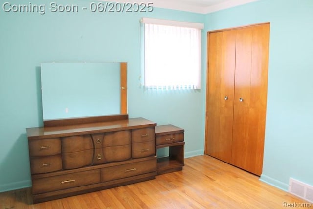 9396 Allen Rd, Allen Park, MI 48101 - unfurnished bedroom with a closet and wood finished floors