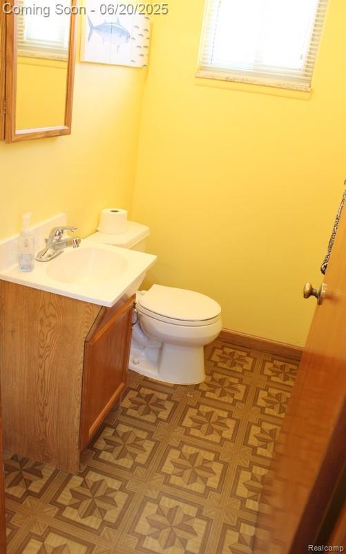 9396 Allen Rd, Allen Park, MI 48101 - half bath featuring vanity and tile patterned floors