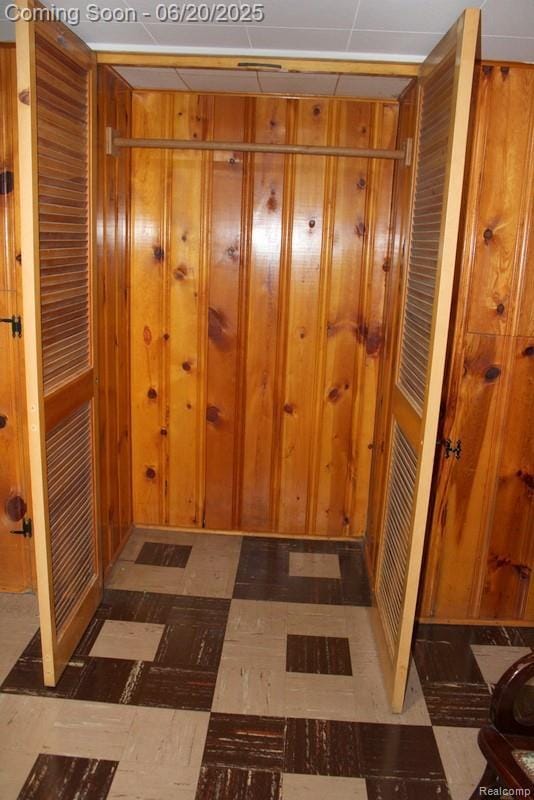 9396 Allen Rd, Allen Park, MI 48101 - hallway with tile patterned floors and wooden walls