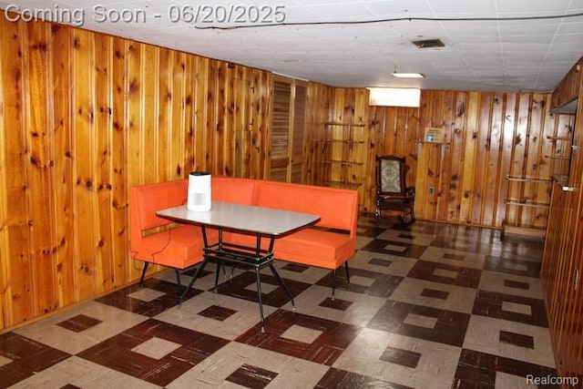 9396 Allen Rd, Allen Park, MI 48101 - dining area with tile patterned floors and wooden walls
