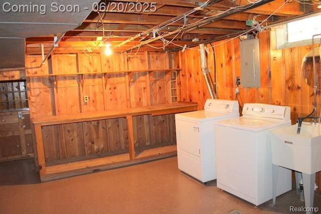 9396 Allen Rd, Allen Park, MI 48101 - laundry area featuring electric panel, washing machine and clothes dryer, and wooden walls