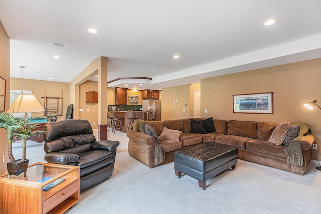 10310 E Rivershore Dr SE, Alto, MI 49302 - living room with light carpet, recessed lighting, and bar area