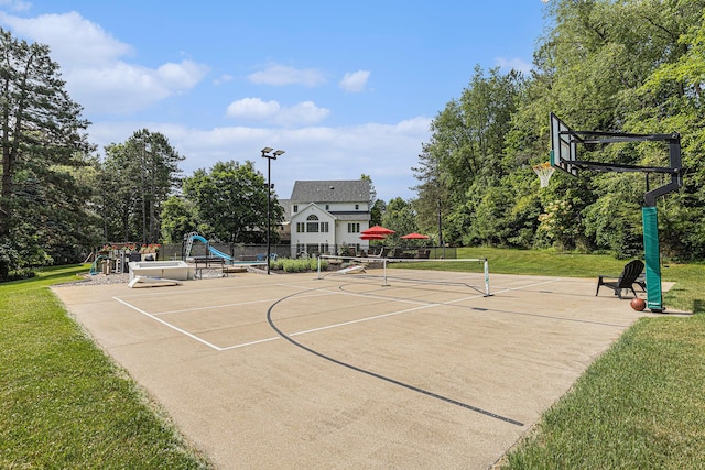 10310 E Rivershore Dr SE, Alto, MI 49302 - view of sport court with community basketball court and view of scattered trees