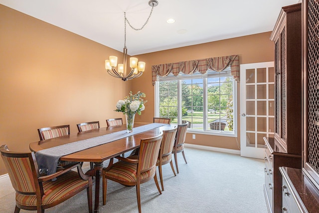10310 E Rivershore Dr SE, Alto, MI 49302 - dining room featuring a chandelier and light carpet