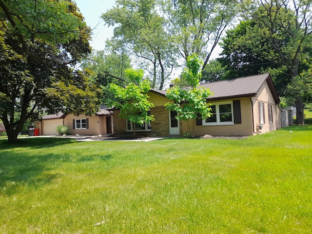 5615 Carlburt St, West Bloomfield, MI 48322 - ranch-style house featuring a garage and a front lawn