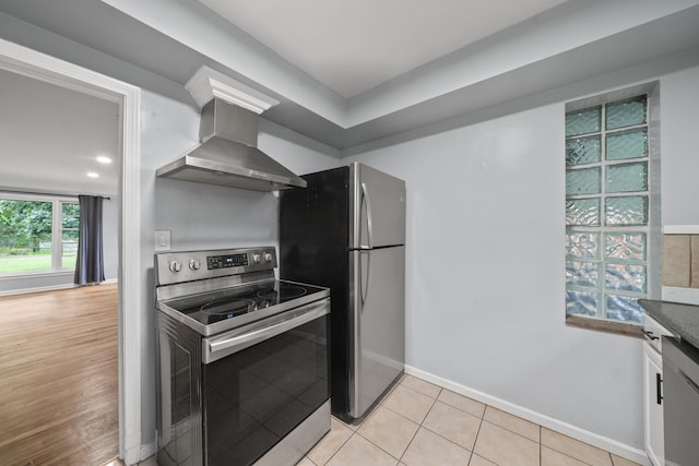 5615 Carlburt St, West Bloomfield, MI 48322 - kitchen featuring appliances with stainless steel finishes, wall chimney range hood, and light tile patterned floors
