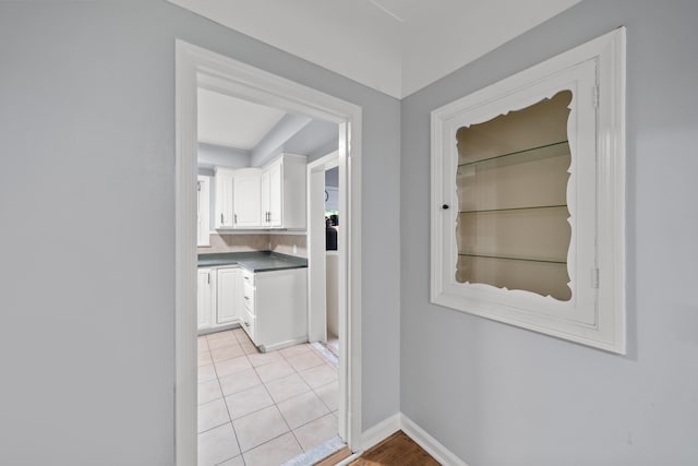 5615 Carlburt St, West Bloomfield, MI 48322 - hall with baseboards and light tile patterned floors