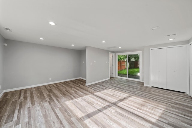 5615 Carlburt St, West Bloomfield, MI 48322 - unfurnished living room featuring wood finished floors and recessed lighting